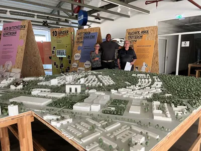 Veteran Bruce and his wife Brenda with our new friend Marvin and a model of Benjamin Franklin Village.