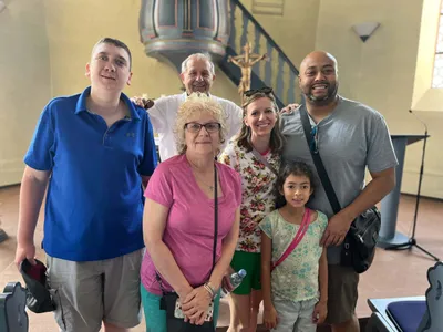Hillary and her family in the church where her forefathers were baptized.