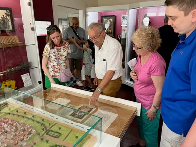 Hillary and her family in a museum of the hometown of her ancestors.
