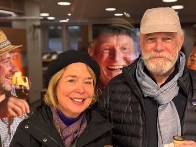 Funny picture of Yvonne and Vic in front of a poster inside the winery Alde Gott.